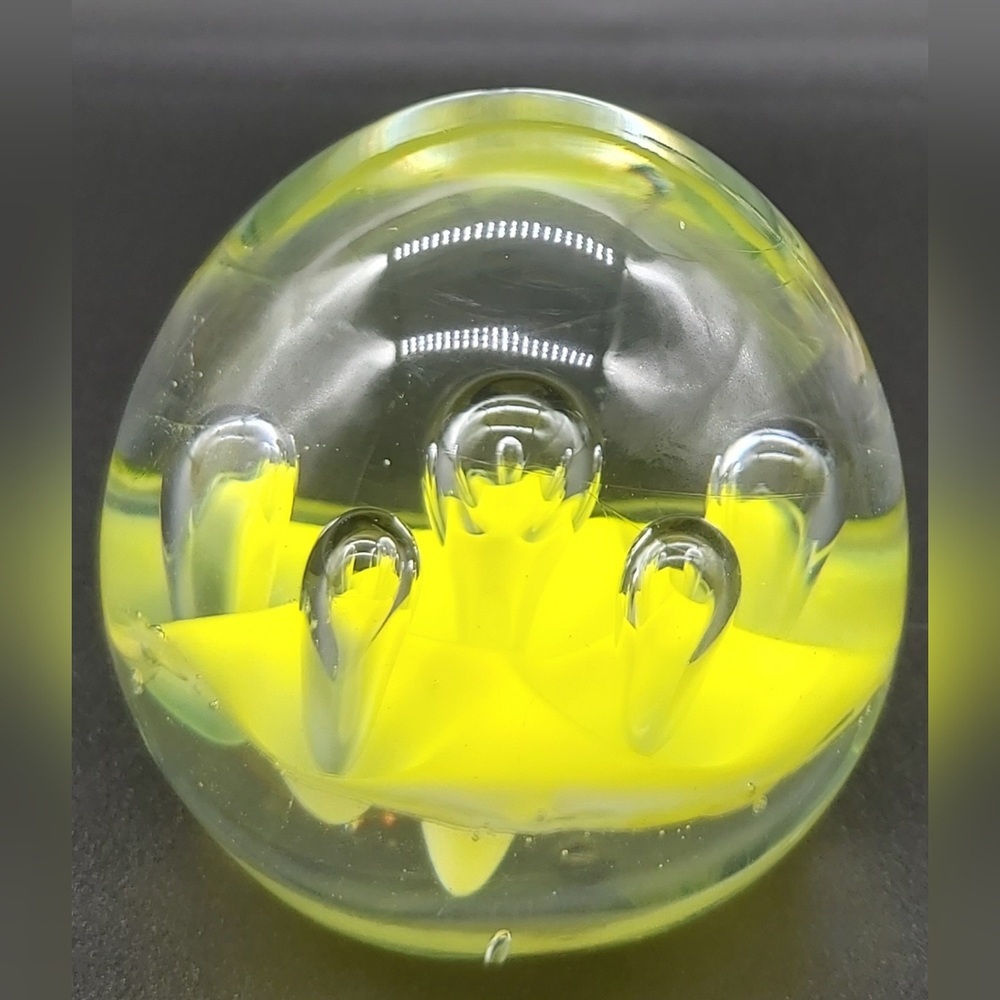 Art glass yellow paperweight with teardrop bubbles